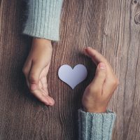 paper-heart-couple-s-hands-wooden-table-e1670094283153.jpg paper-heart-couple-s-hands-wooden-table-e1670094283153.jpg